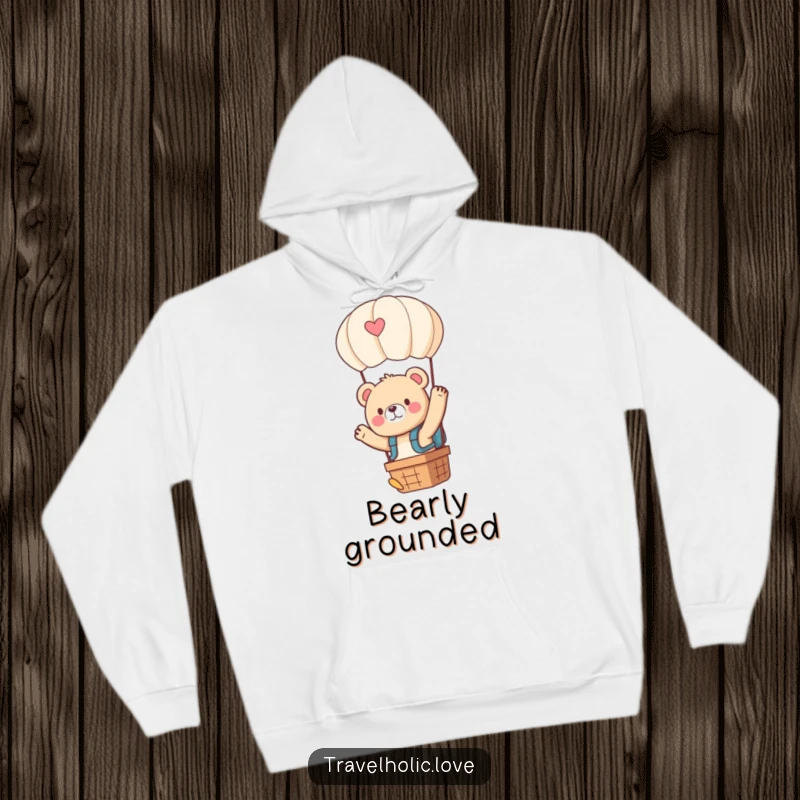 Funny kawaii bear with a tiny backpack, waving from a hot air balloon, warm and comfortable hoodie.