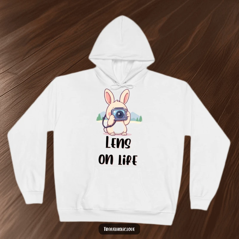 Funny kawaii rabbit with a tiny camera, taking photos of distant mountains, warm and comfortable hoodie.